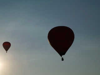A silhouette of two balloons during sunset, Balloon Day Hradec Kralove