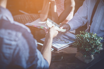 businessman signing contract and handshake after business negotiations to finally success