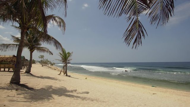 Tropical island with white sandy beach in blue lagoon, palm tree. Patarl white sand beach with turquoise water. Seascape, ocean and beautiful beach. Philippines, Anda, Pangasinan. Travel concept.