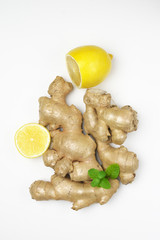 Ginger roots with lemon and mint leaves