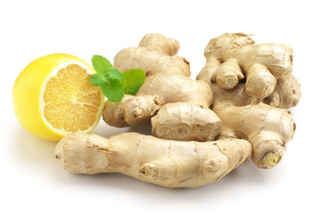 Ginger roots with lemon and mint leaves