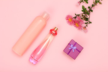 Gift box and cosmetics on a pink background