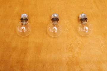  light bulbs on a wood background