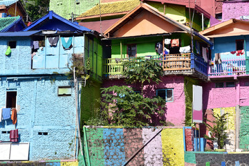 Fototapeta na wymiar Colorful houses at View of Jodipan village ( Kampung Warna Warni ) in Malang City, East Java, Indonesia