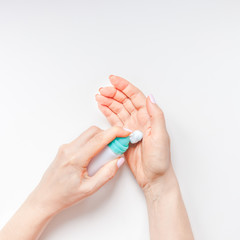 Woman moisturizing her hands with foam lotion