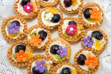 Catering sweets, closeup of various kinds of cakes on event or wedding reception  - selective focus