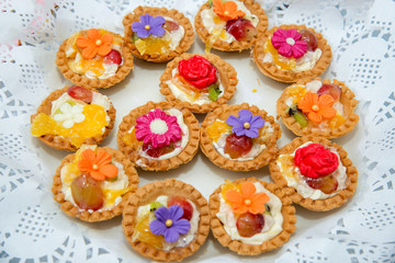 Catering sweets, closeup of various kinds of cakes on event or wedding reception  - selective focus