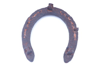 old rusty horseshoe on a white background