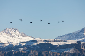 The Swiss Air Force flies with its helicopters a display in the Alps in the Bernese Oberland in Switzerland