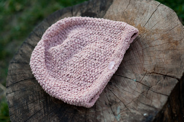 Women's beautiful warm woolen hat with a large knit shot in natural light