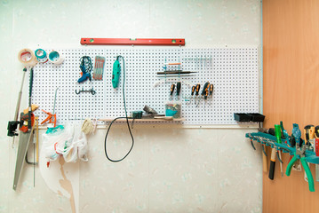 Workplace with tools on a wall