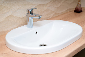 The photo of a sink in a bathroom