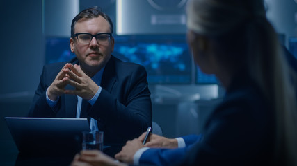 Corporate Executive Debates with His Female Senior Advisor on a Meeting of the Board of Directors....