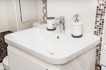 The photo of a sink in a bathroom