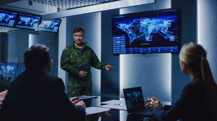 High-Ranking Military Man holds a Briefing to a Team of Government Agents and Politicians, Shows Satellite Surveillance Footage.  - obrazy, fototapety, plakaty
