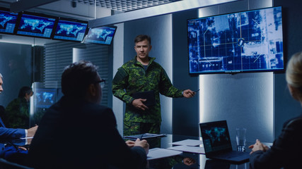 High-Ranking Military Man holds a Briefing to a Team of Government Agents and Politicians, Shows...