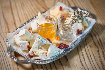different type of cheese on the tray 