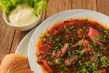 Delicious borscht with lamb, beetroot, herbs and spices