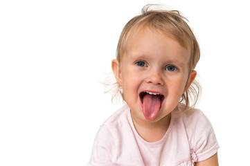 Little baby girl showing tongue isolated on white