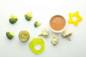 Flat lay composition with healthy baby food and ingredients on white background