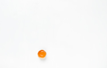 Egg.One cracked on a white background.