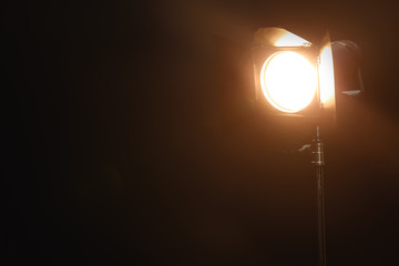 Fototapeta na wymiar Professional lighting equipment on dark background