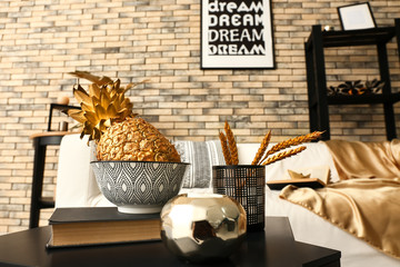 Stylish golden decor in interior of room