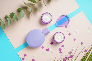 Composition with cosmetics on color background