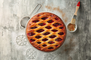 Sweet tasty Christmas pie stuffed with cranberries on table