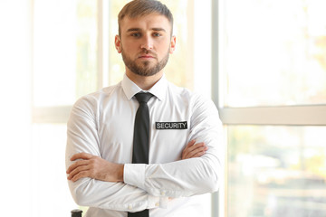 Male security guard indoors