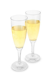 Glasses of champagne on white background