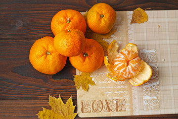 Tangerines are delicious and fragrant peeled and peeled on the table.