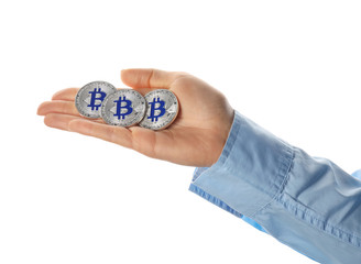 Female hand with bitcoins on white background