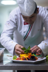 chef serving vegetable salad