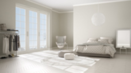 Blur background interior design, comfortable modern bedroom with wooden parquet floor, panoramic window, carpet, armchair and bed with blanket and pillows, minimal architecture