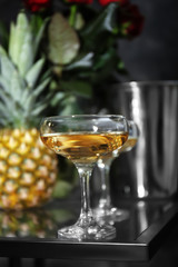 Glass of champagne on dark table