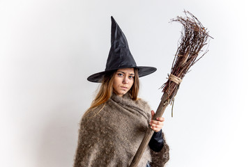 A young woman wearing a witch costume