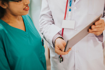Doctor and nurse discussing a medical case