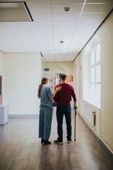 Physiatrist training a patient to walk again