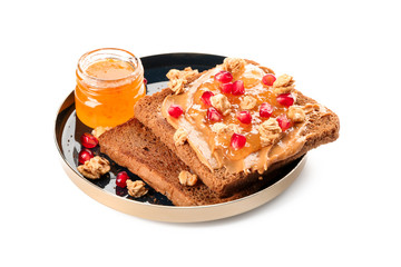 Plate with sweet toasts and jam on white background