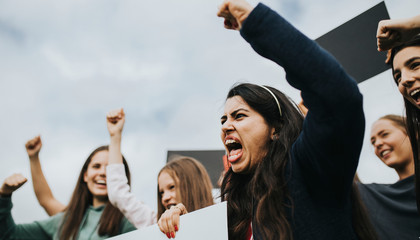 Group of angry female activists is protesting - obrazy, fototapety, plakaty