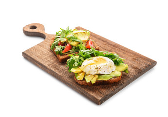 Wooden board with tasty toasts on white background