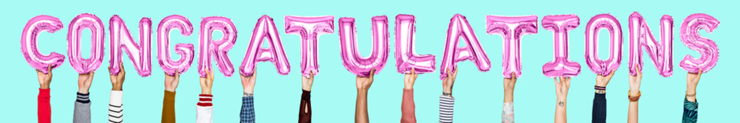 Hands holding congratulations word in balloon letters