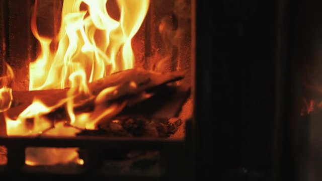 Reflection of fire in stove glass pan to fire