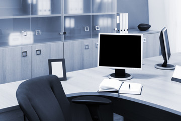 monitors on a desks in office