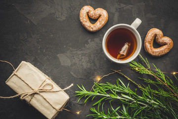 tea - a cup of tea and gifts for the holiday. Brewed tea bag, cup of tea and a festive atmosphere....