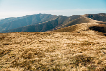 Amazing mountain landscape with bright, bright sunset on the sky, natural background for outdoor travel. Beautiful nature.
