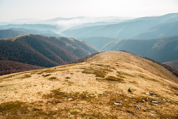 Amazing mountain landscape with bright, bright sunset on the sky, natural background for outdoor travel. Beautiful nature.