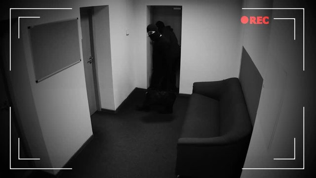 Two dangerous masked men disarming burglar alarm system, braking into bank vault