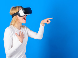 Funny woman experiencing 3D gadget technology - close up. Excited smiling businesswoman wearing...